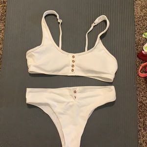 Buttons are real and come undone.